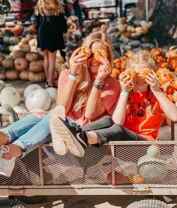 Mother and Daughter in U-pick pumpkin patch